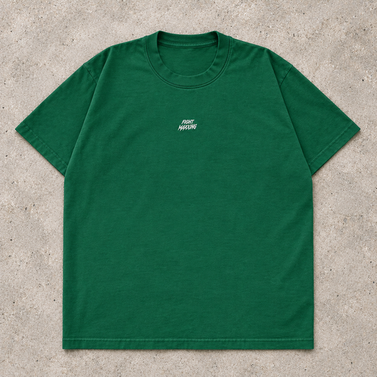 Fight Maxxing relaxed tee in green, laid flat on grey cement