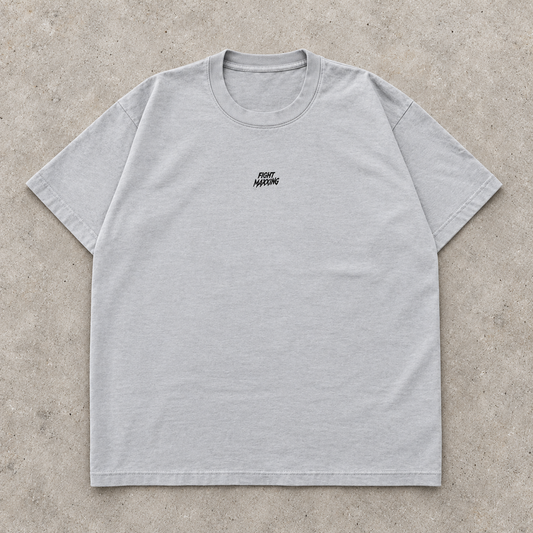 Fight Maxxing relaxed tee in grey, laid flat on grey cement