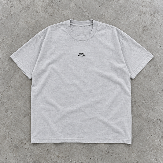 Fight Maxxing relaxed tee in grey, laid flat on grey cement